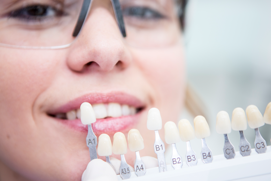 girl smiling while her teeth is being checked
