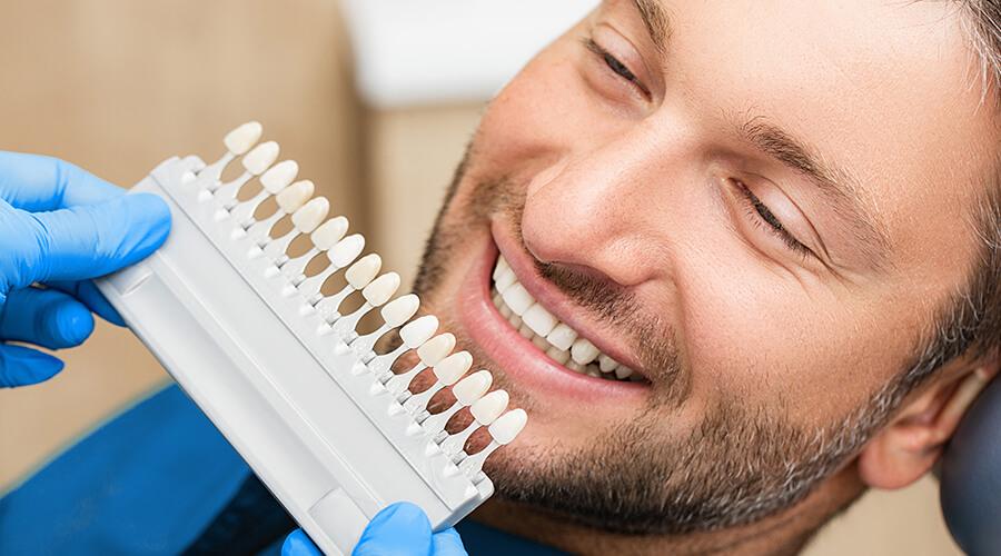 girl smiling while her teeth is being checked